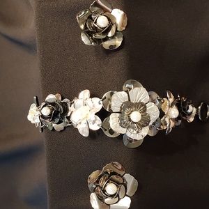 Bracelet with matching earrings.  Three-dimensional pieces with white pearls.